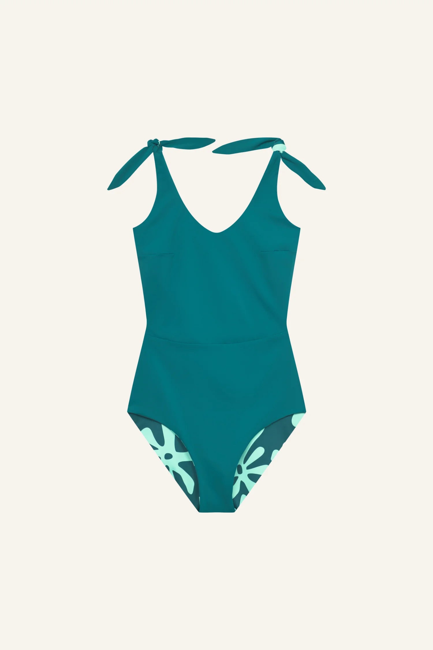 MYMARINI Badeanzug in Türkis mit V-Ausschnitt und breiten Trägern, zeigt florales Muster an den Beinausschnitten.#color_jungle-print