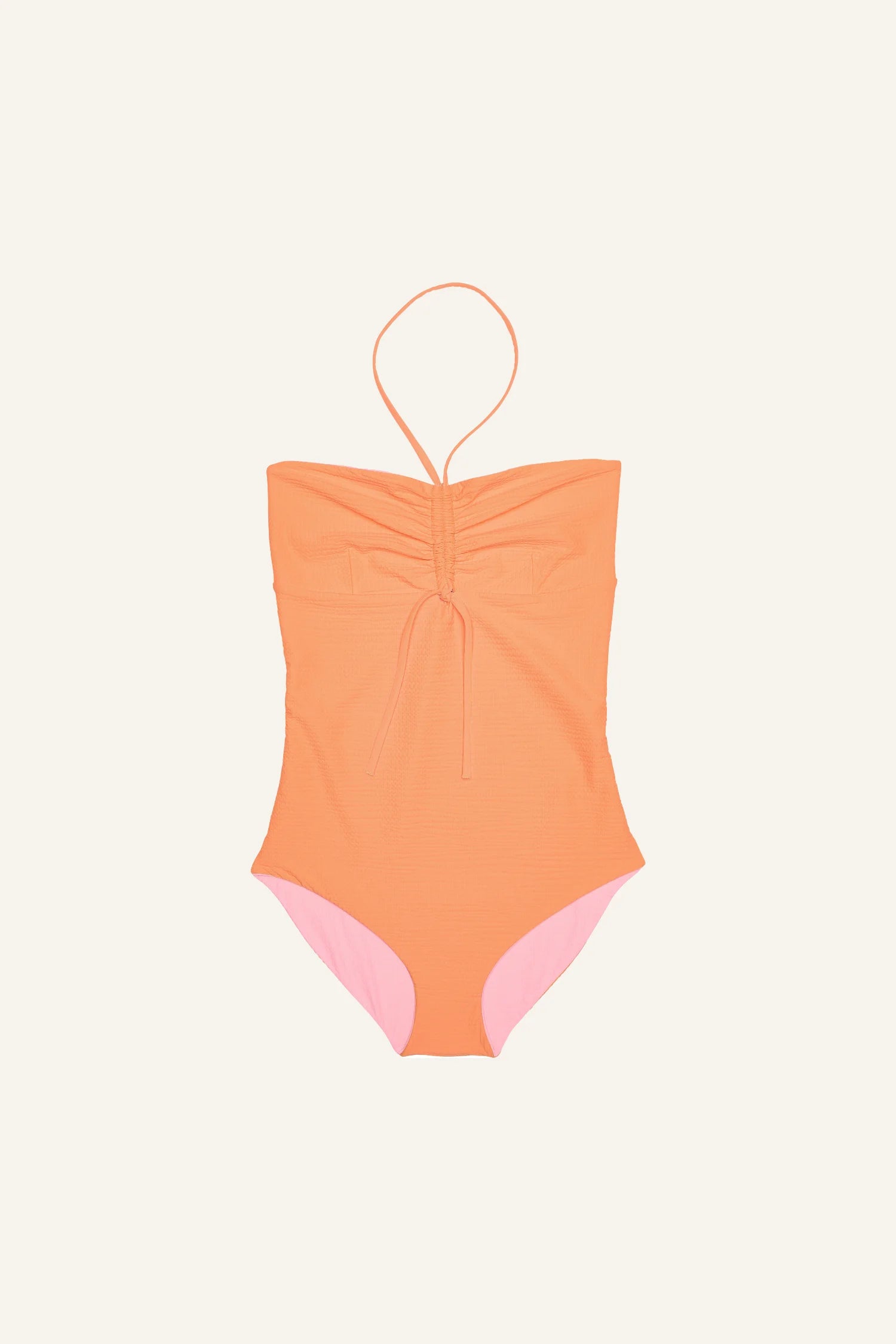MYMARINI One-Piece in Orange mit Neckholder und hohem Beinausschnitt auf hellem Hintergrund.#color_marshmallow-peach
