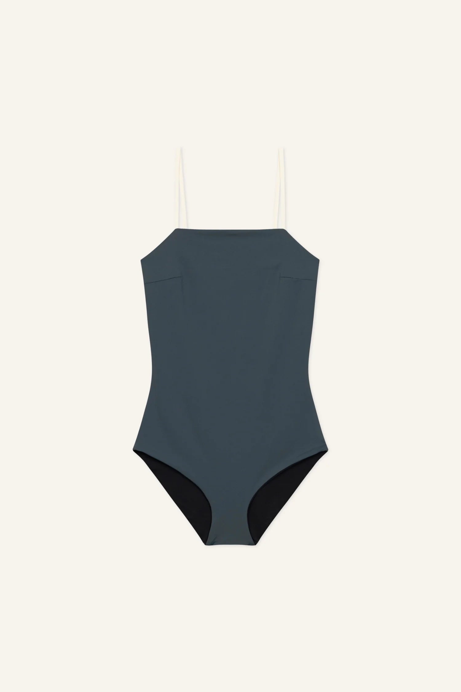 MYMARINI One-Piece Badeanzug in Dunkelblau mit Spaghettiträgern und hohem Beinausschnitt vor hellem Hintergrund.#color_black-grey-white