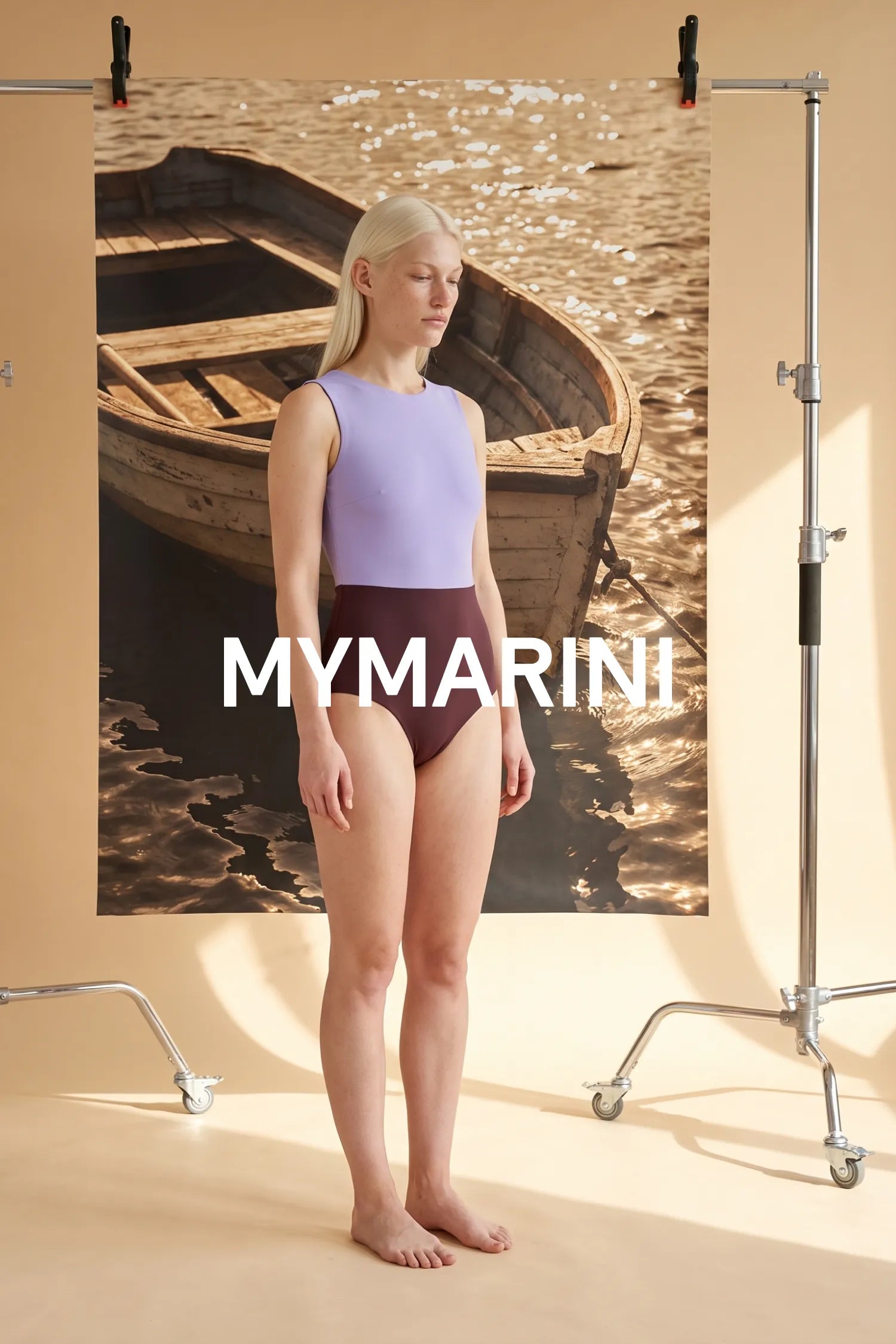 AI-generated, Model wearing the high-waist MYMARINI swimsuit in chocolate-lilac by a rowboat on the water