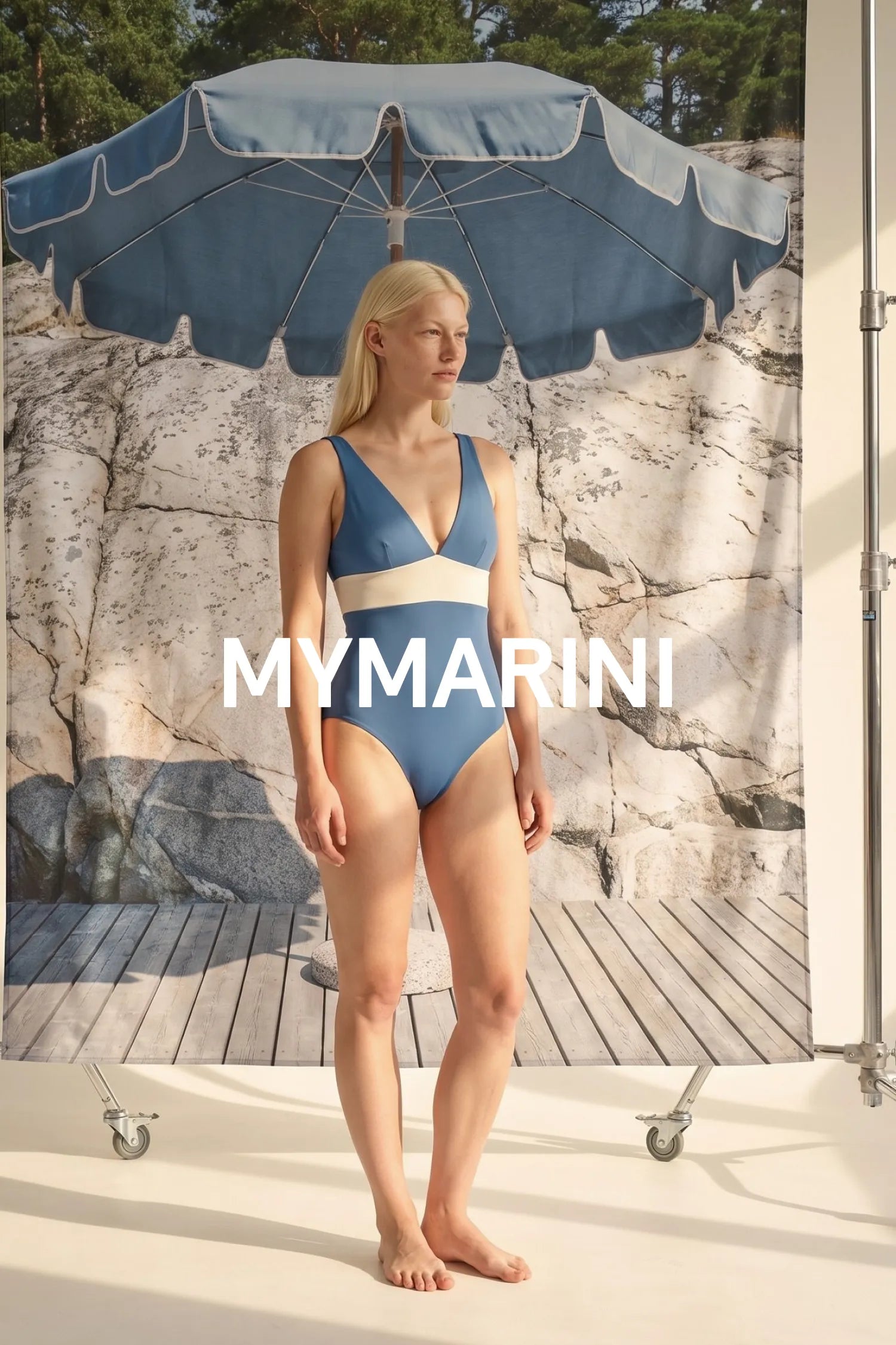 AI-generated, Model wearing the MYMARINI swimsuit with a V-neckline in coast-desert by a blue parasol