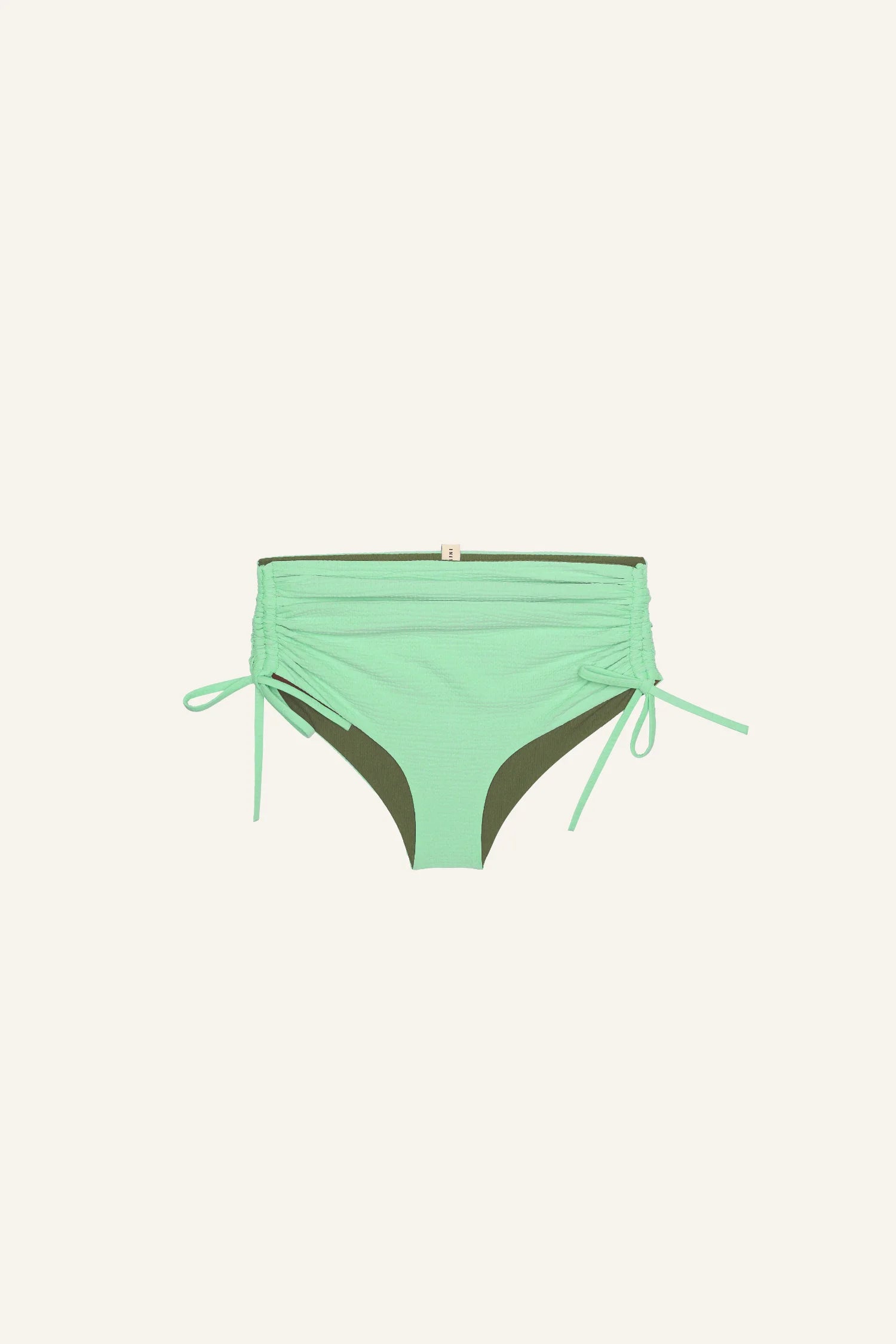 MYMARINI Bikinihose in Mintgrün mit seitlichen Bändern, hoher Beinausschnitt, auf hellem Hintergrund.#color_lagoon-seaweed