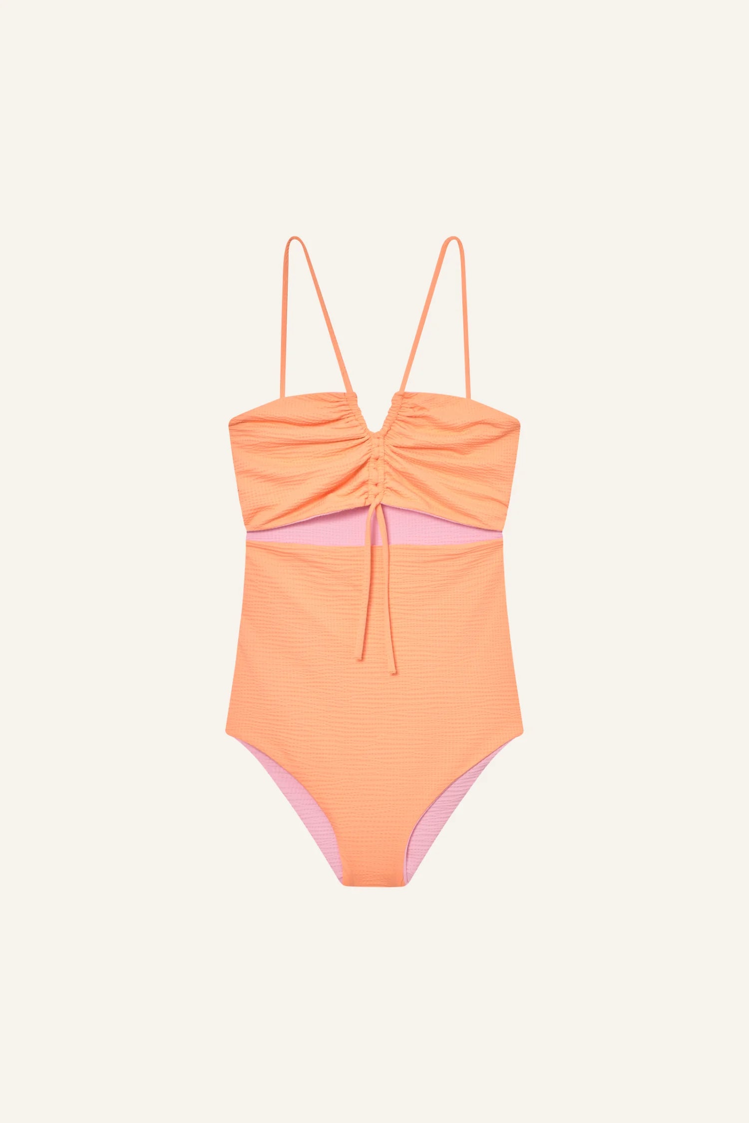 Ein orangefarbener MYMARINI Badeanzug mit Spaghettiträgern und hohem Beinausschnitt vor hellem Hintergrund.#color_marshmallow-peach