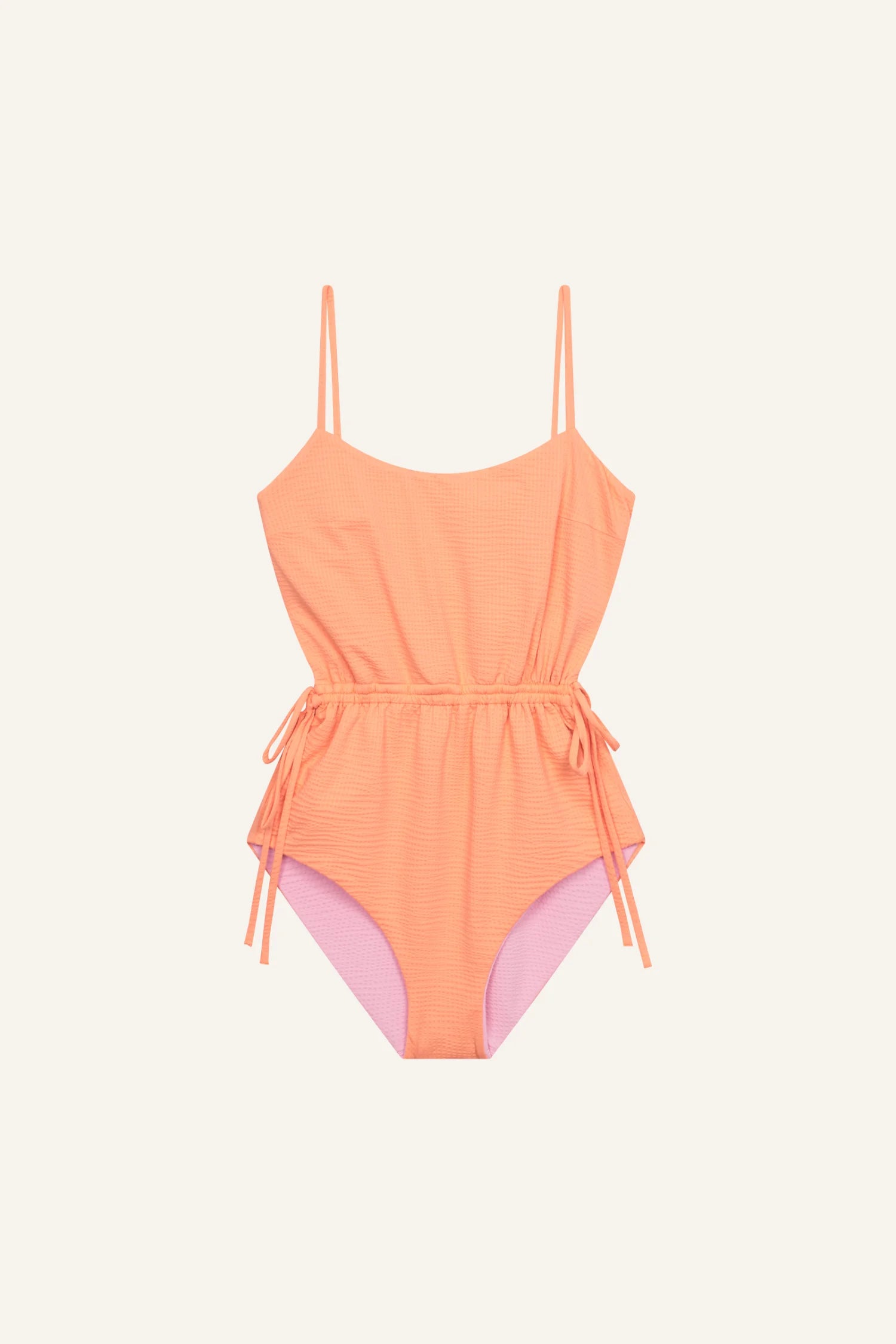 MYMARINI Badeanzug in Orange mit Spaghettiträgern und hohem Beinausschnitt, seitlich mit Bändern verziert.#color_marshmallow-peach