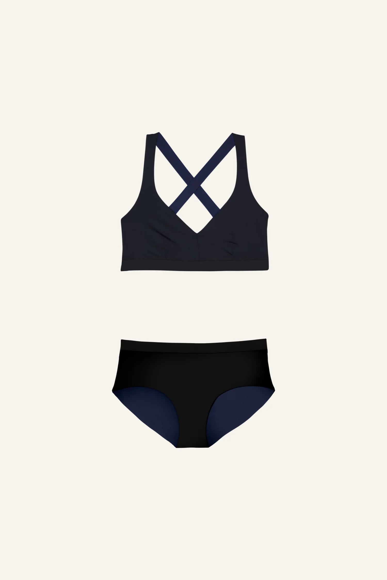 Schwarzes MYMARINI Bikinitop mit Cross-Back und passende Bikinihose, beide mit hohem Beinausschnitt, auf hellem Hintergrund.#color_black-navy