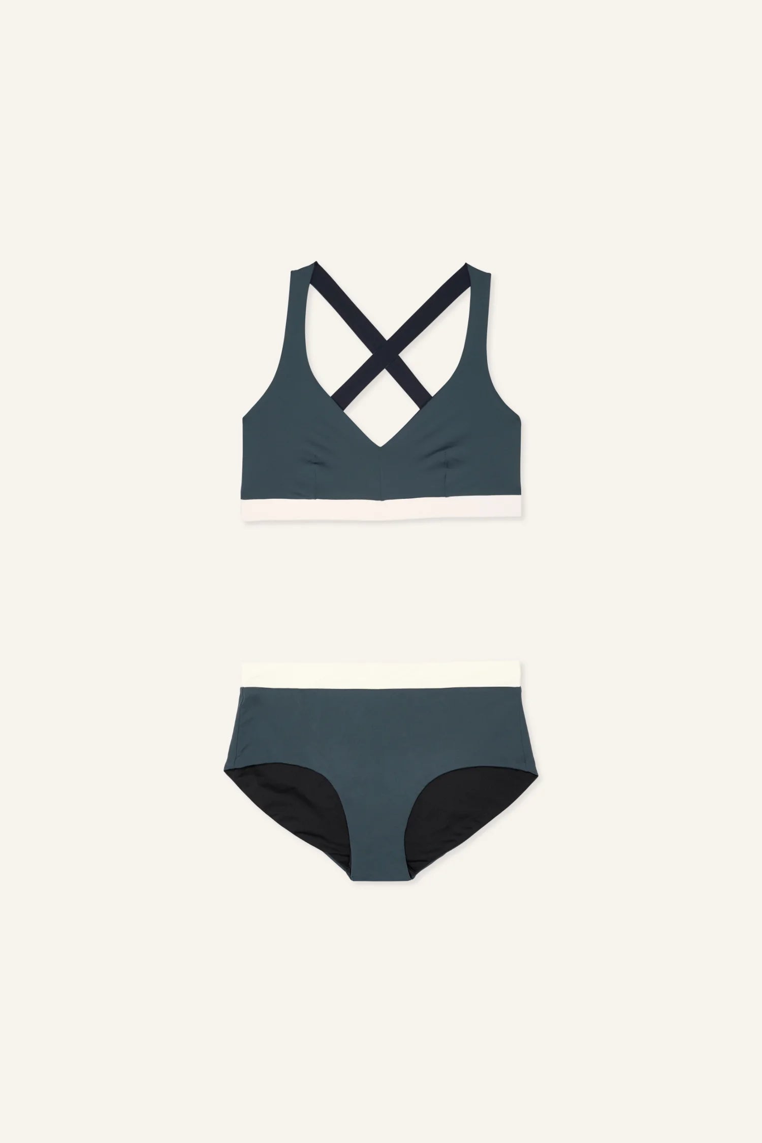 MYMARINI Bikini-Set in Dunkelgrün mit weißem Bund, Cross Top und Mid rise Bikinihose auf hellem Hintergrund.#color_black-grey-white